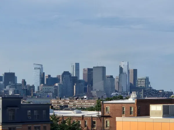 a view of a city with tall buildings