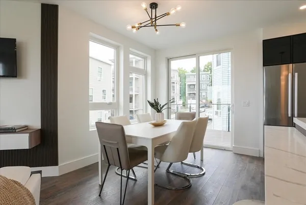 a view of a dining room with furniture window and outside view