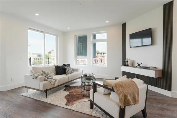 a living room with furniture and a window