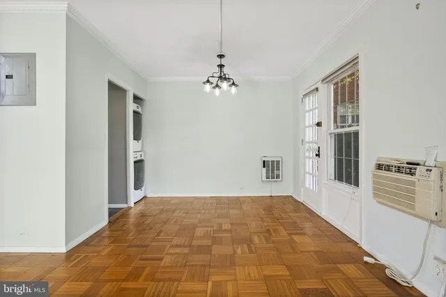a view of a hallway with a chandelier