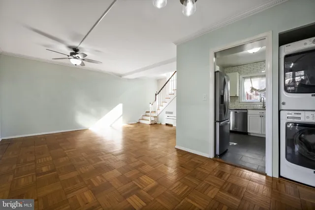 wooden floor in an empty room with a fireplace