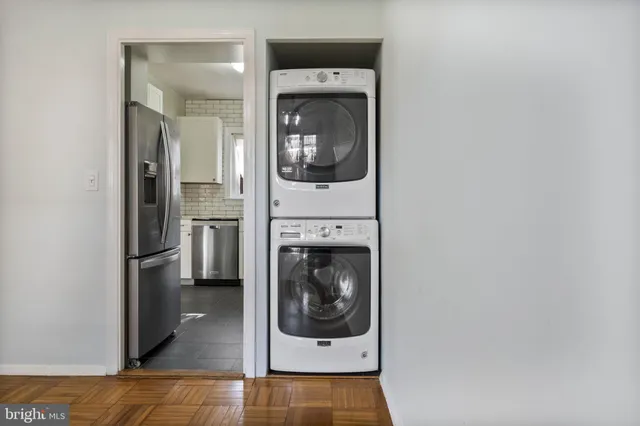 a living room with a fireplace and a rug