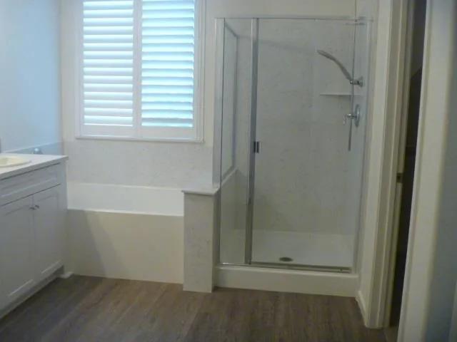 a bathroom with 2 sink and a mirror