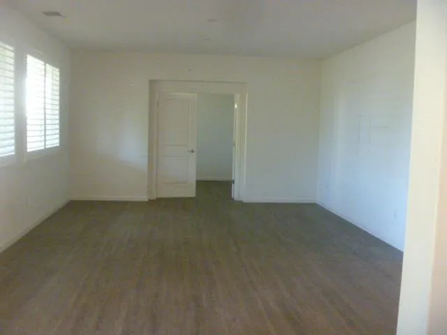 an empty room with a empty space and window