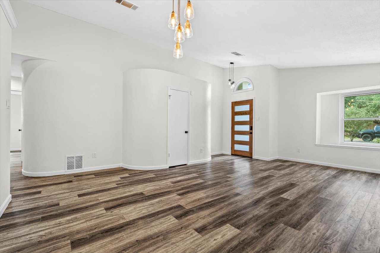 4004 Danli Lane Austin, TX 78749 - Photo 8 of 40 a view of an empty room with window and wooden floor
