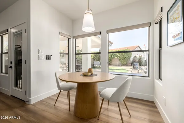 a living room with furniture a rug and a large window