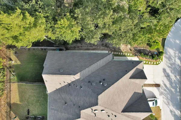 an aerial view of house with yard