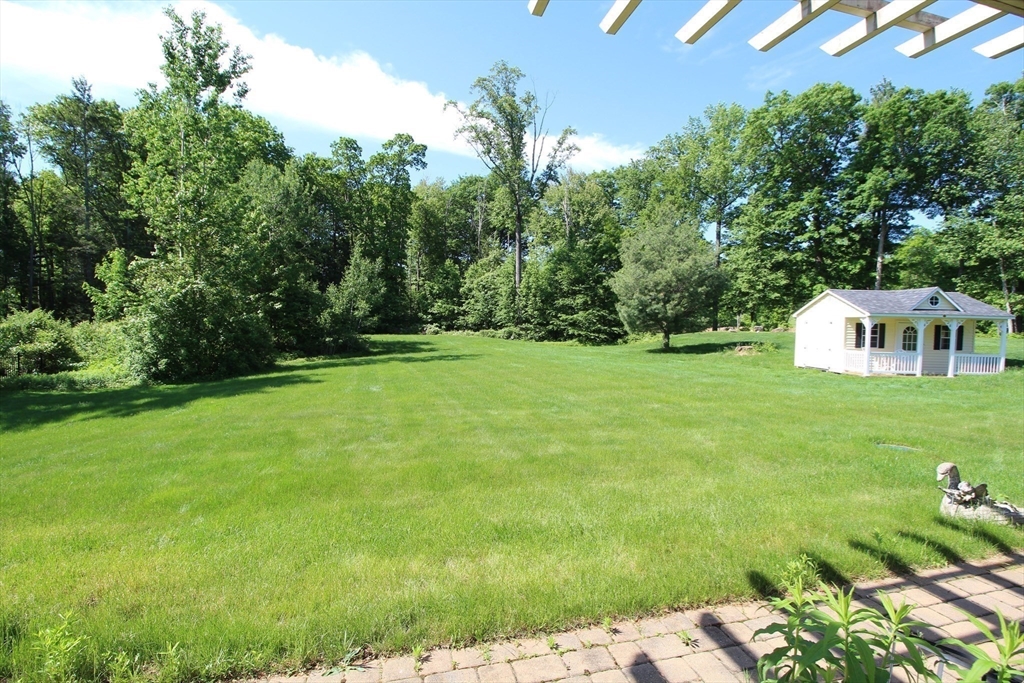 5 Gableview Lane Southwick, MA 01077 - Photo 14 of 41 a backyard of a house with lots of green space