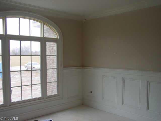 5622 Cape Fox Drive Oak Ridge, NC 27310 - Photo 4 of 4 Other. Extensive millwork in Dining Room and throughout home
