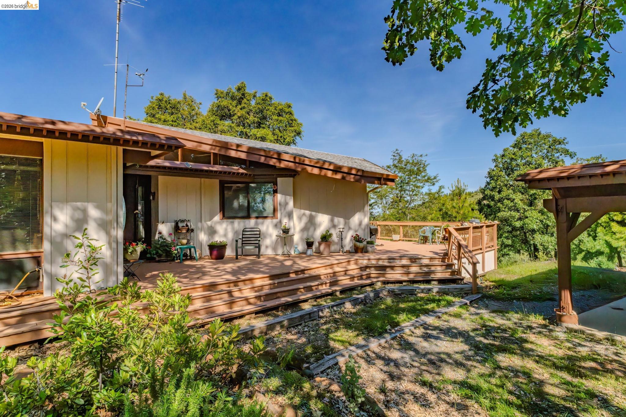 6161 Fullen Road Murphys, CA 95247 - Photo 6 of 53 a view of a house with backyard sitting area and garden