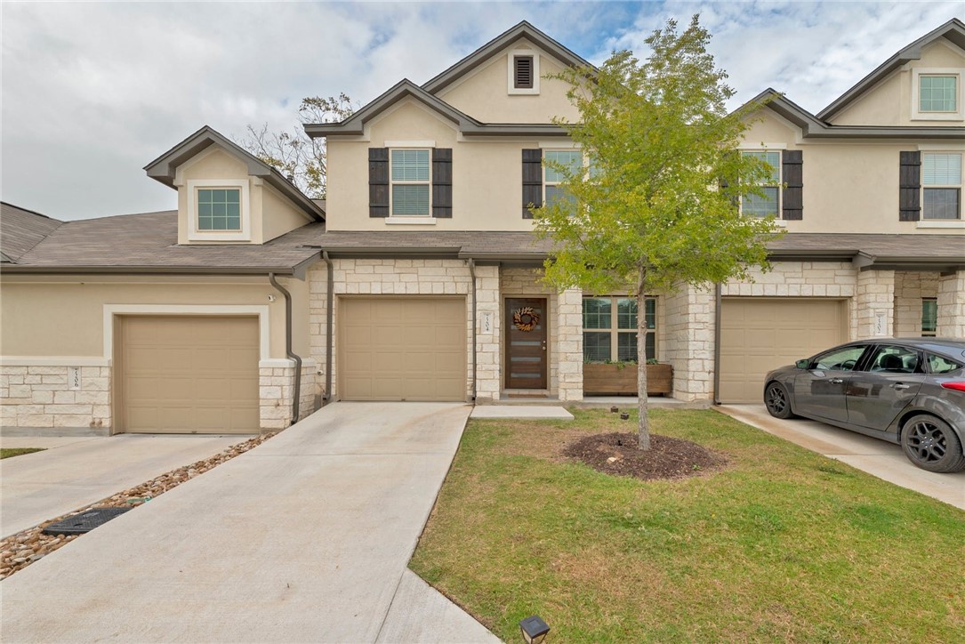 7204 Redding Drive, Unit 202 Austin, TX 78745 - Photo 1 of 1 a front view of a house with a yard