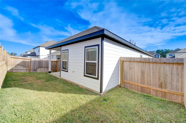 a view of a backyard of the house