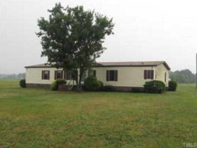 259 Princeton Road Princeton, NC 27569 - Photo 1 of 3 a front view of a house with a garden