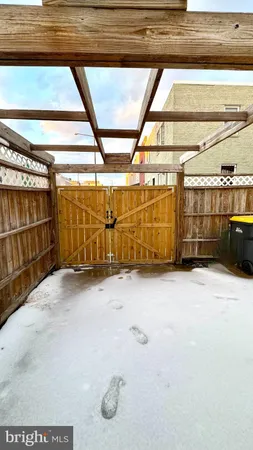 a view of a garage with wooden floor