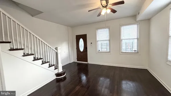 a view of an entryway with wooden floor