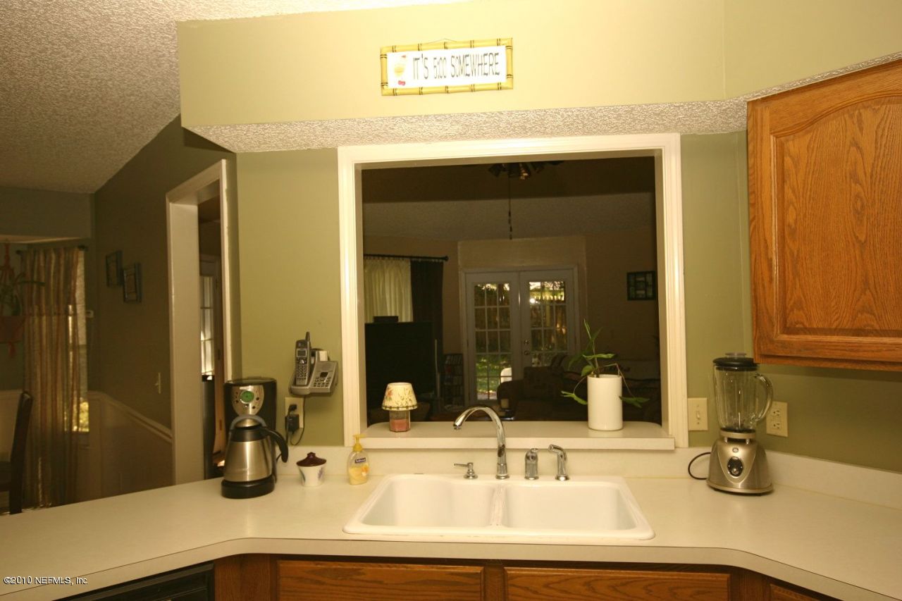 3125 Nautilus Road Middleburg, FL 32068 - Photo 8 of 23 a bathroom with a sink and a mirror