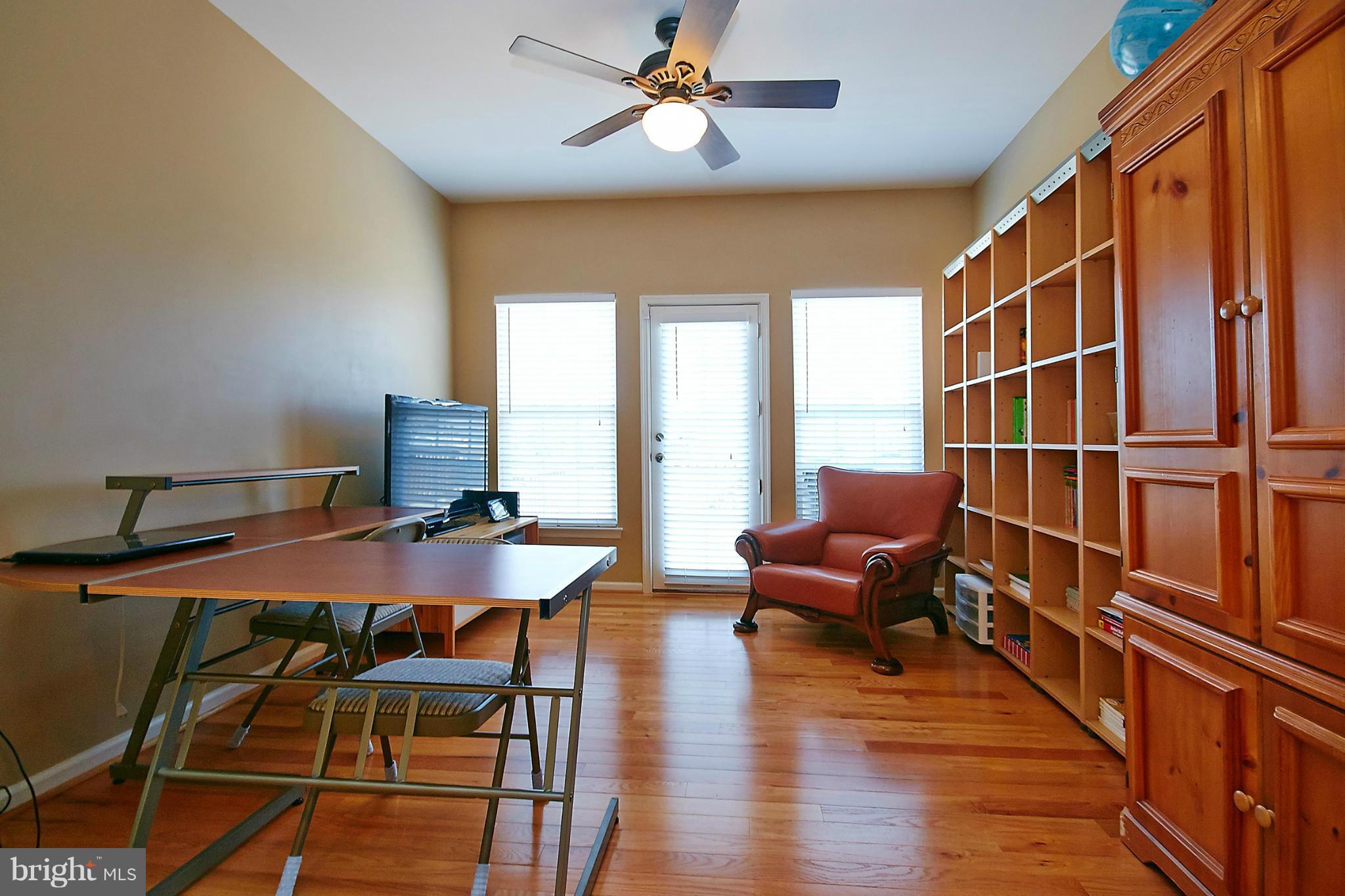 9639 Innerwick Place Bristow, VA 20136 - Photo 11 of 29 a view of a livingroom with furniture window and wooden floor