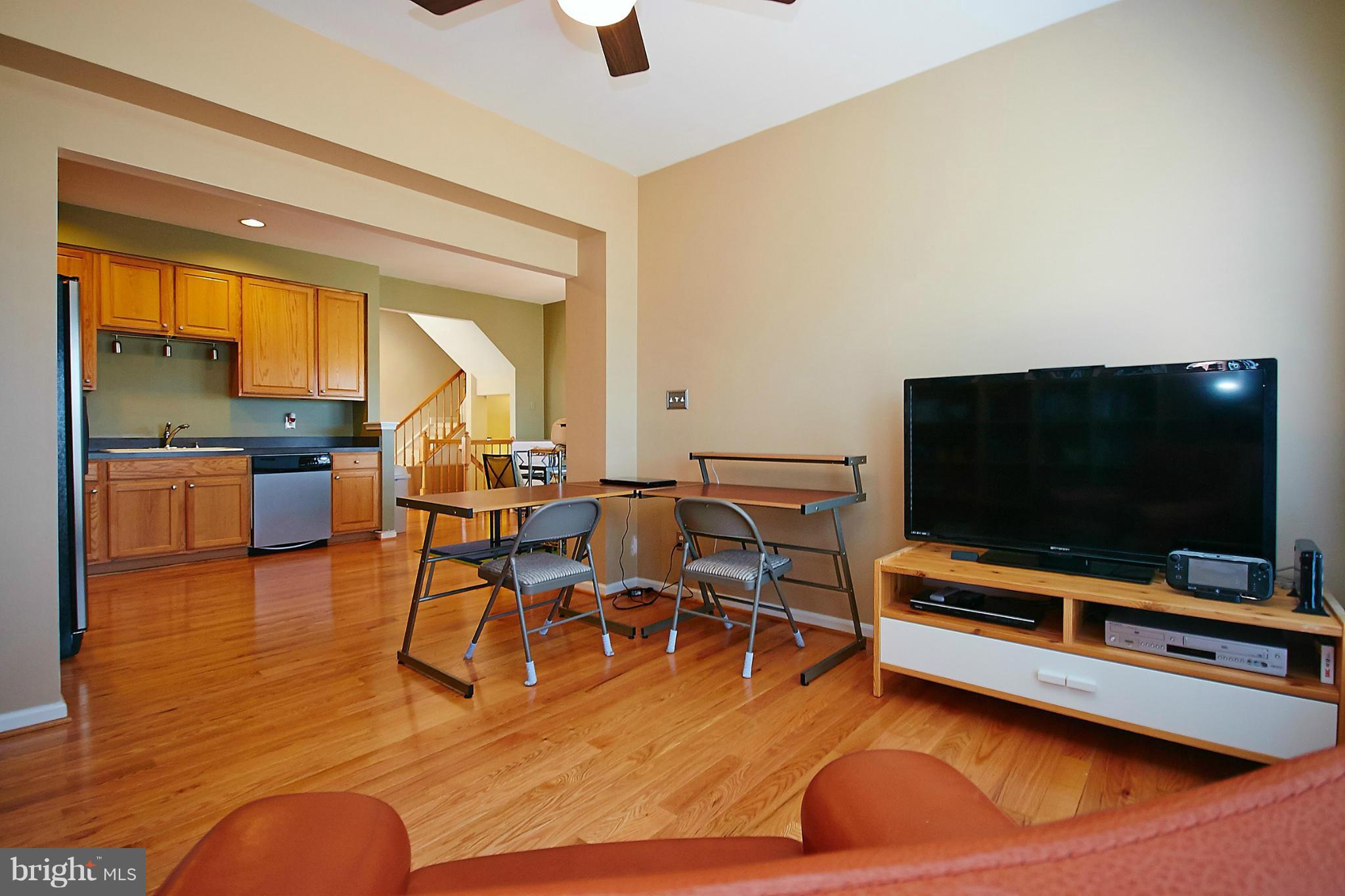 9639 Innerwick Place Bristow, VA 20136 - Photo 12 of 29 a living room with furniture and a flat screen tv