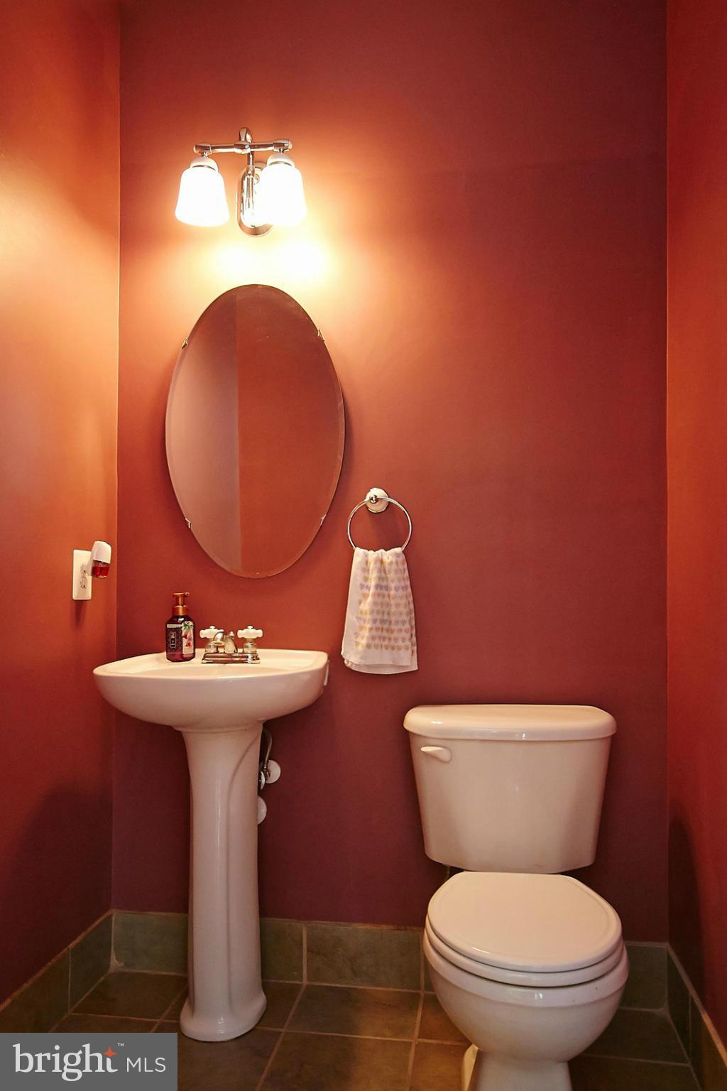 9639 Innerwick Place Bristow, VA 20136 - Photo 13 of 29 a bathroom with a toilet sink and mirror