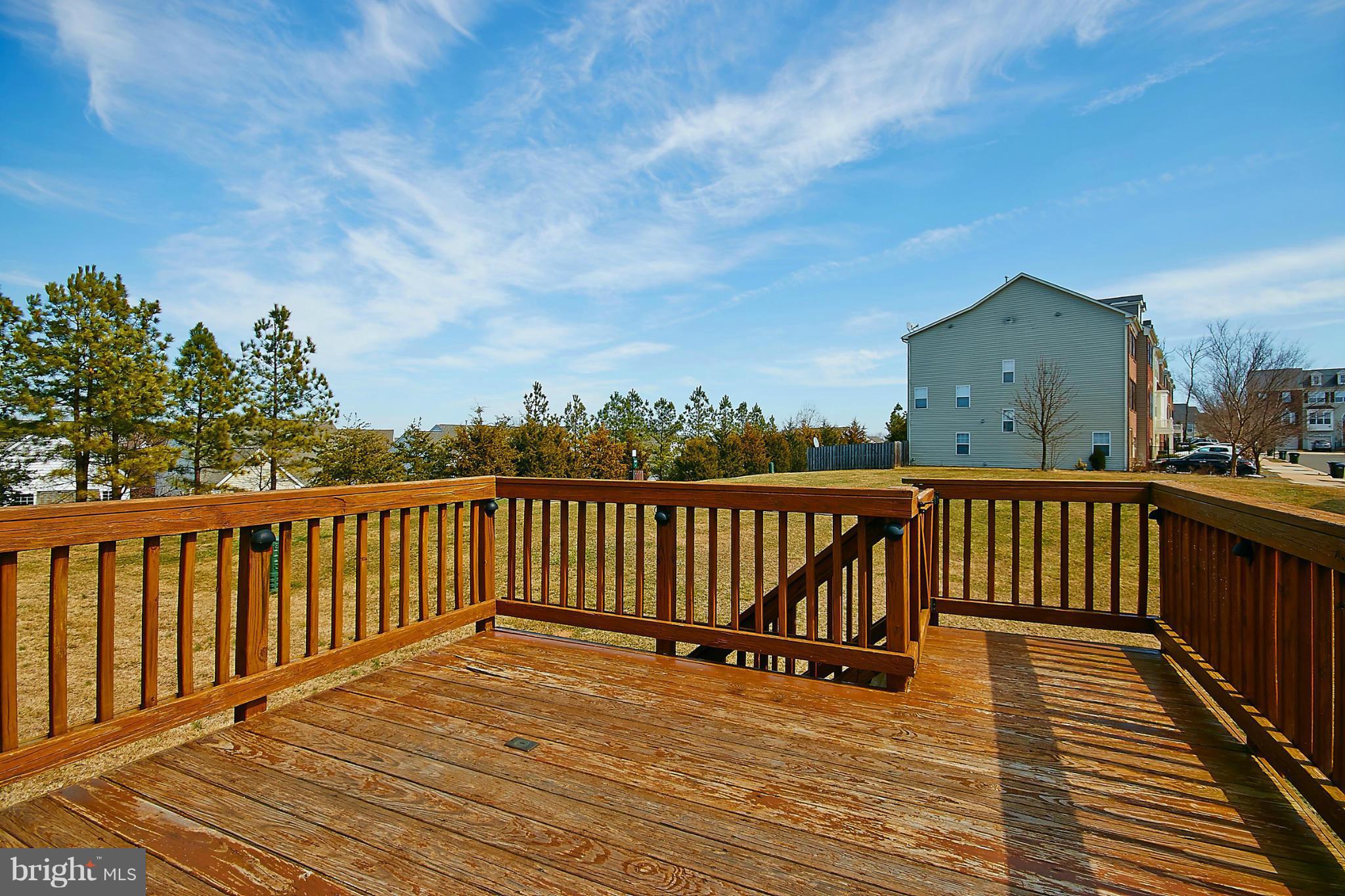 9639 Innerwick Place Bristow, VA 20136 - Photo 26 of 29 a view of balcony with wooden floor and fence