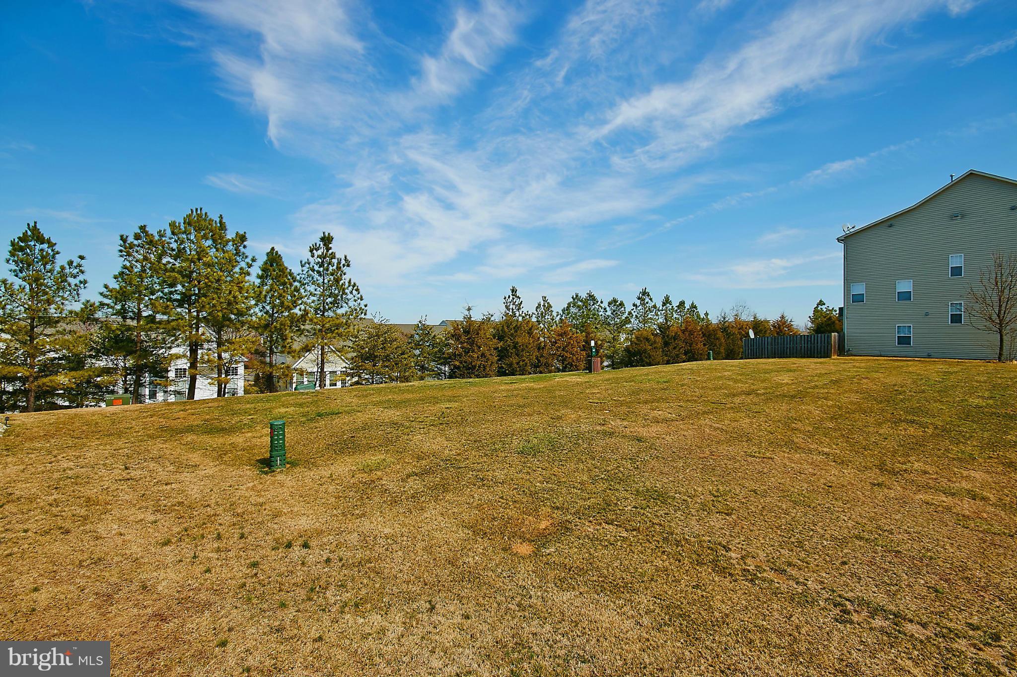 9639 Innerwick Place Bristow, VA 20136 - Photo 27 of 29 a view of a lake with houses