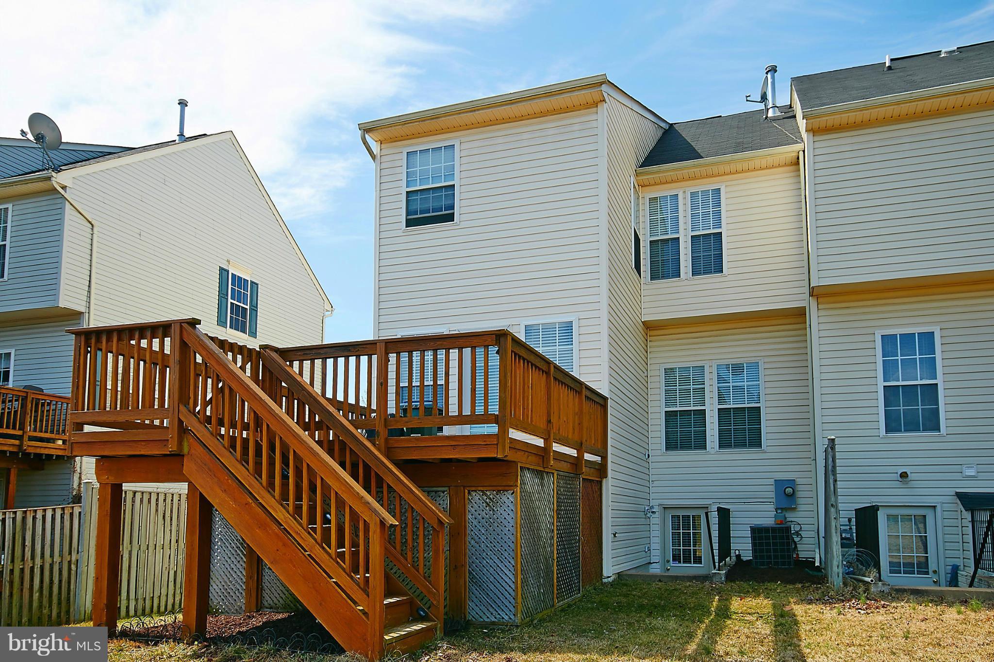 9639 Innerwick Place Bristow, VA 20136 - Photo 29 of 29 a view of a house with a deck
