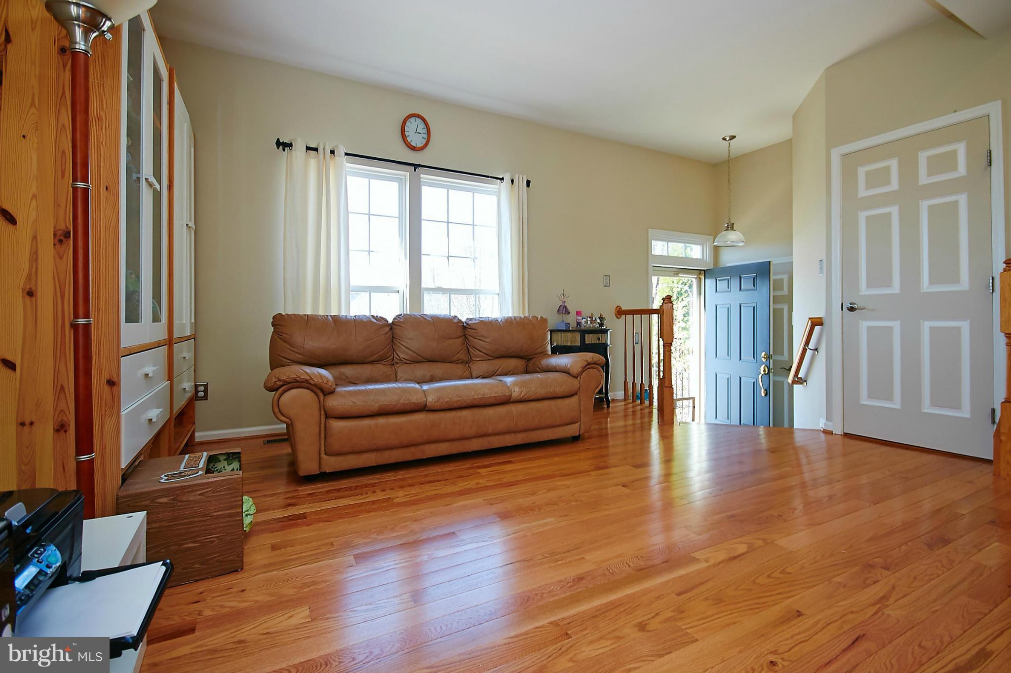 9639 Innerwick Place Bristow, VA 20136 - Photo 4 of 29 a living room with furniture and a window