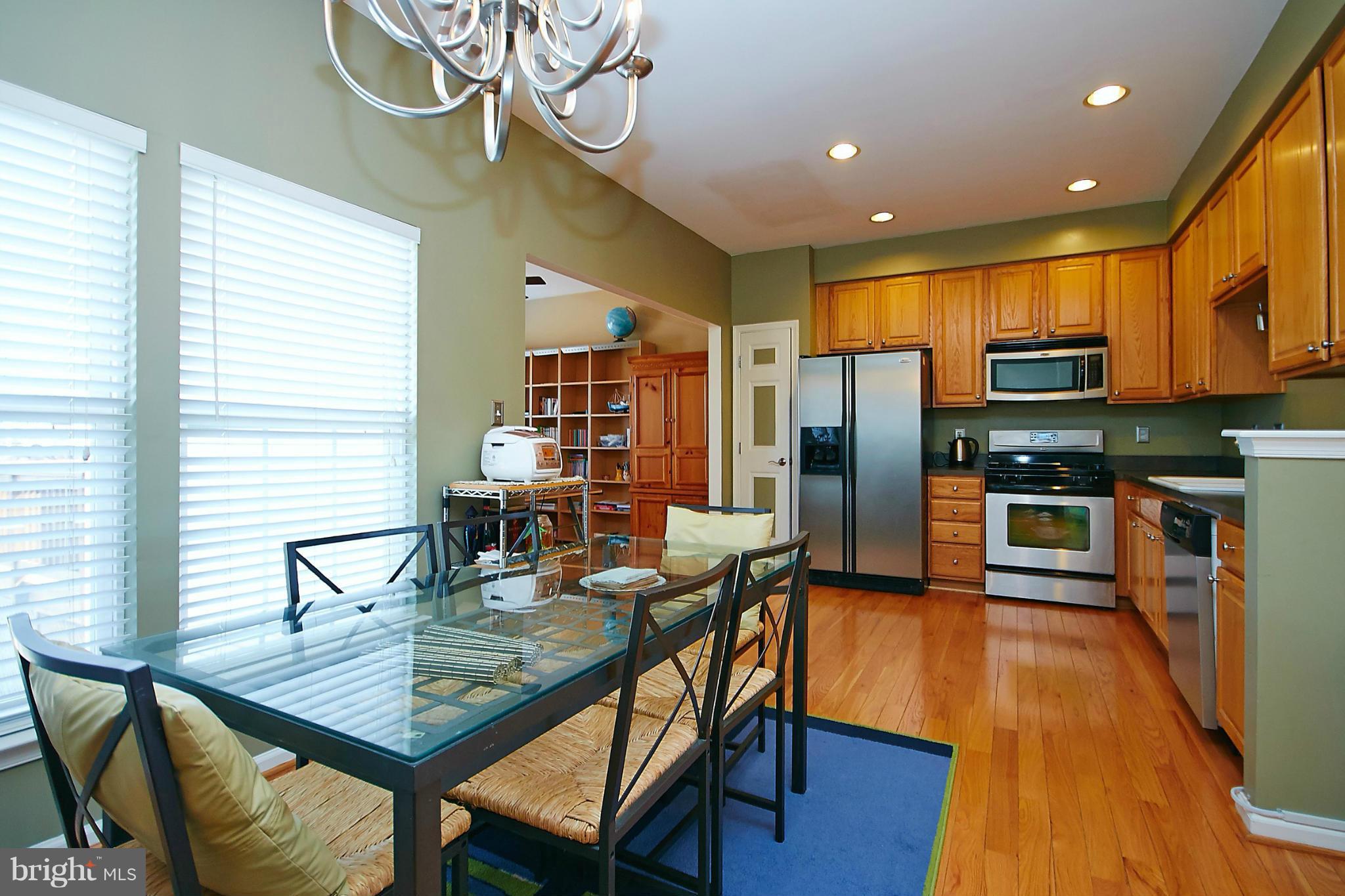 9639 Innerwick Place Bristow, VA 20136 - Photo 7 of 29 a view of a dining room with furniture window and wooden floor