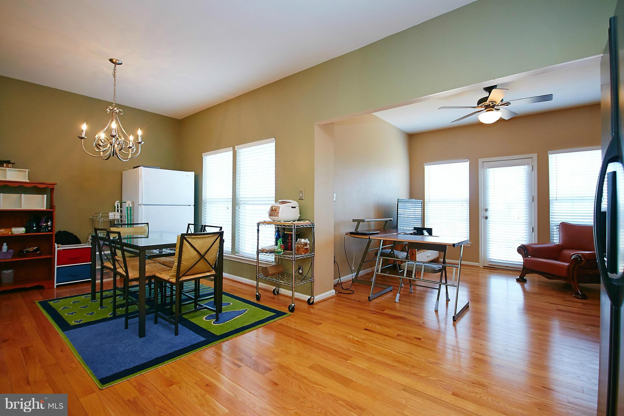 9639 Innerwick Place Bristow, VA 20136 - Photo 8 of 29 a living room with fireplace furniture and a wooden floor