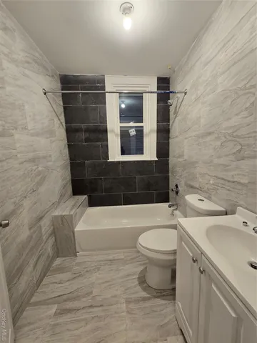 a bathroom with a sink and bathtub