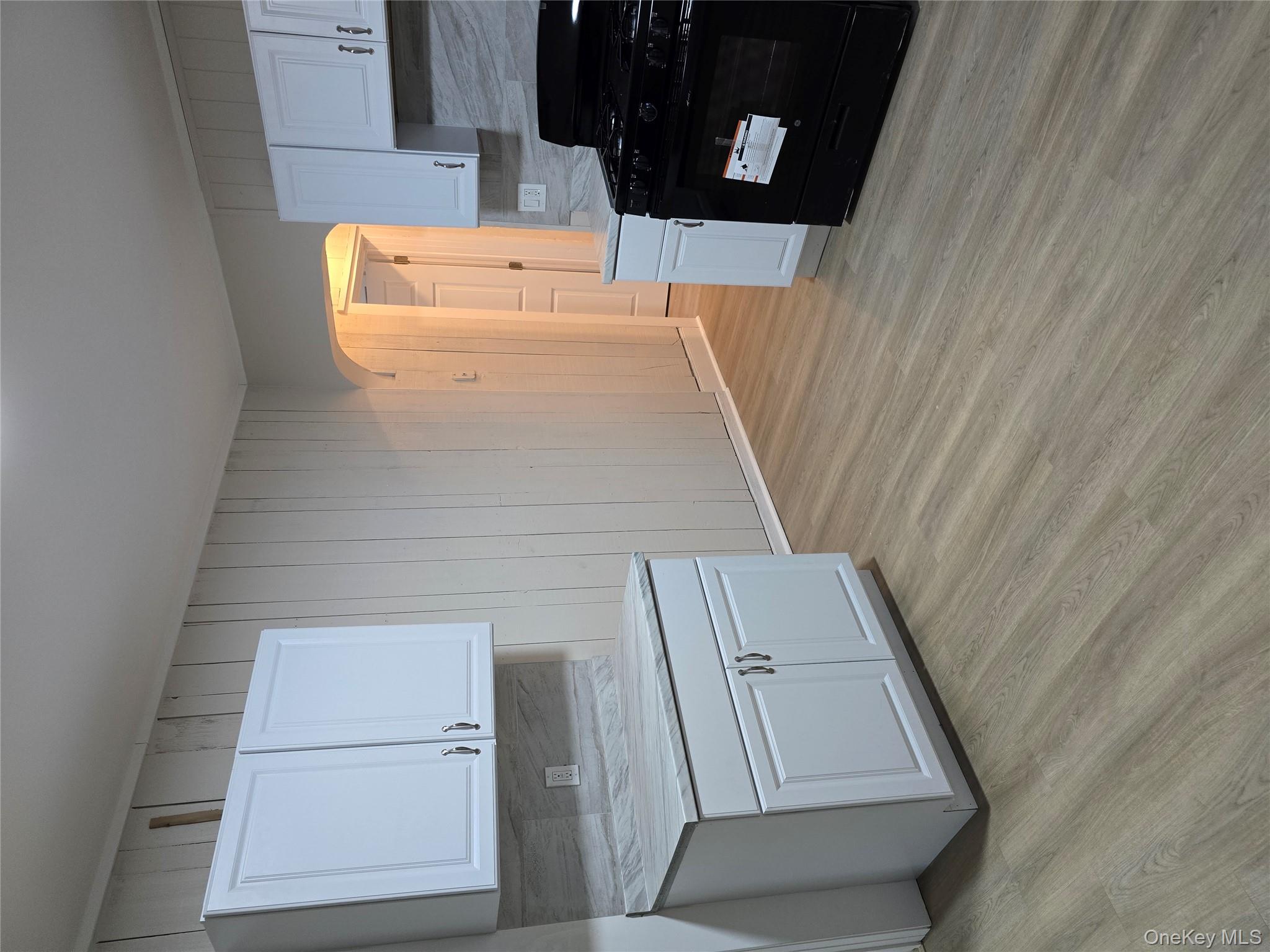 185 Mill Street Poughkeepsie, NY 12601 - Photo 23 of 26 a kitchen with granite countertop a stove a sink and a granite counter tops