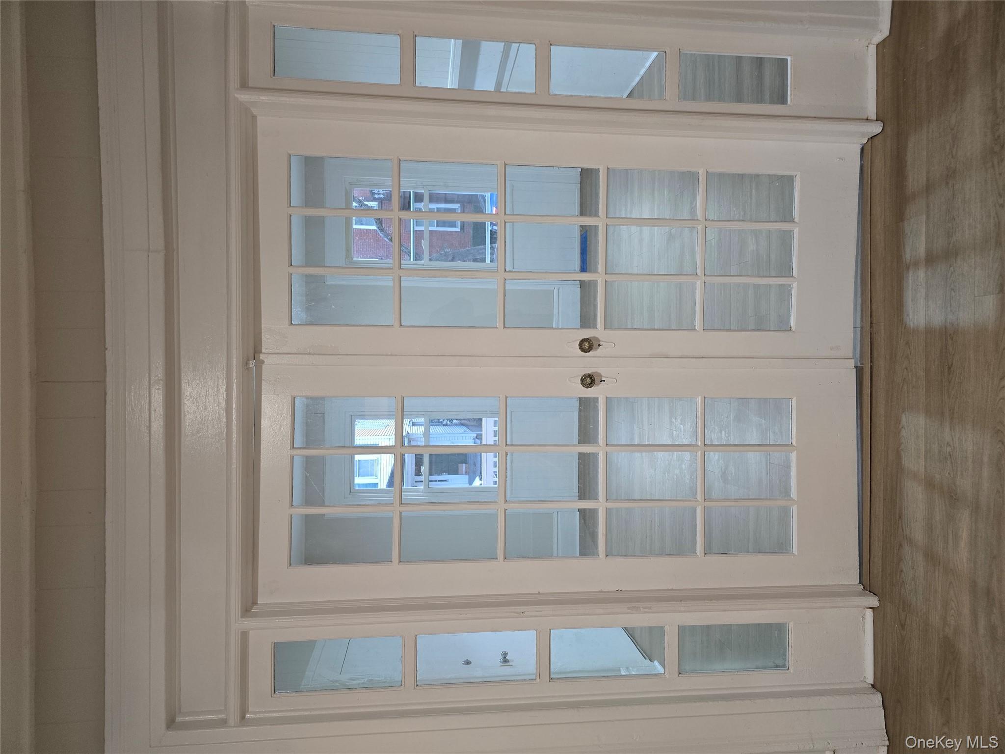 185 Mill Street Poughkeepsie, NY 12601 - Photo 3 of 26 a view of wooden floor and closet in a living room