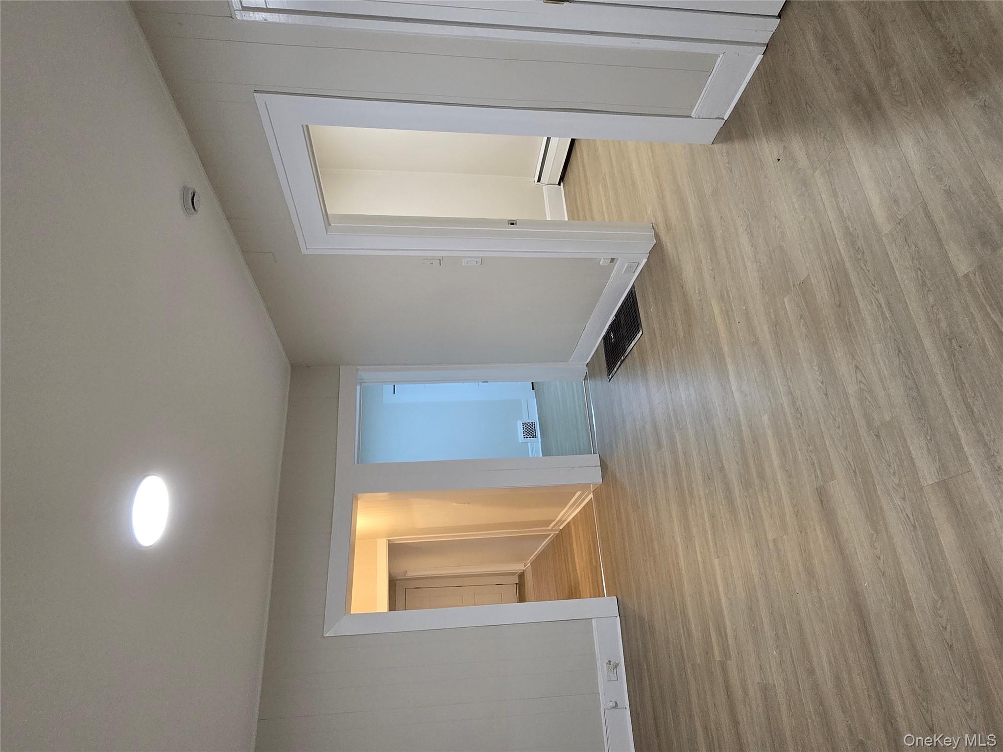 185 Mill Street Poughkeepsie, NY 12601 - Photo 7 of 26 a view of empty room with wooden floor