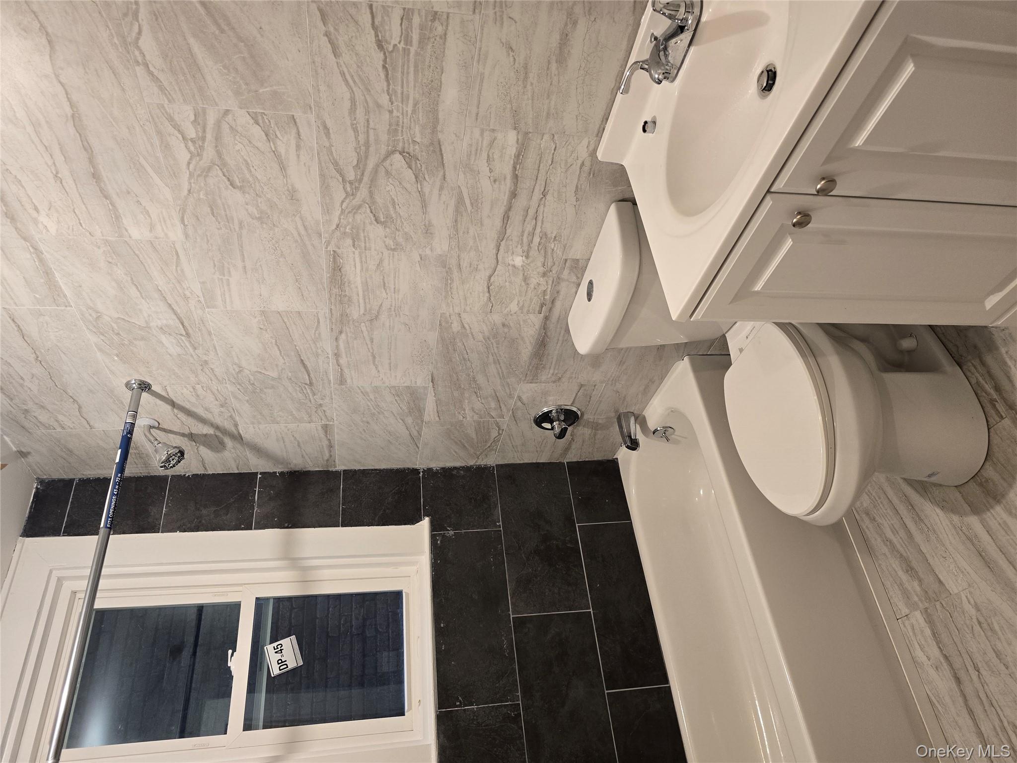 185 Mill Street Poughkeepsie, NY 12601 - Photo 10 of 26 a bathroom with a toilet a sink and bathtub