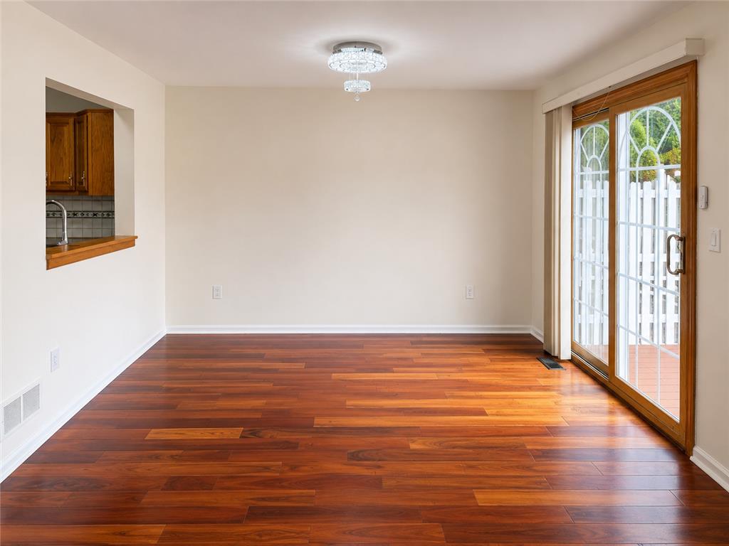 511 Howertown Road Northampton, PA 18067 - Photo 6 of 34 Rich hardwood floors complement neutral walls and offer a pass-through to the adjacent kitchen.