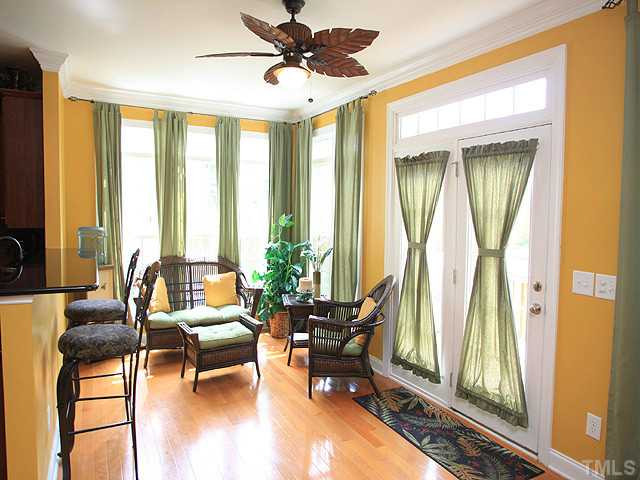 212 Quarryrock Road Holly Springs, NC 27540 - Photo 11 of 25 Huge windows, glass doors to deck, and the transom detail provide a bounty of light in this sun room. Sun Room