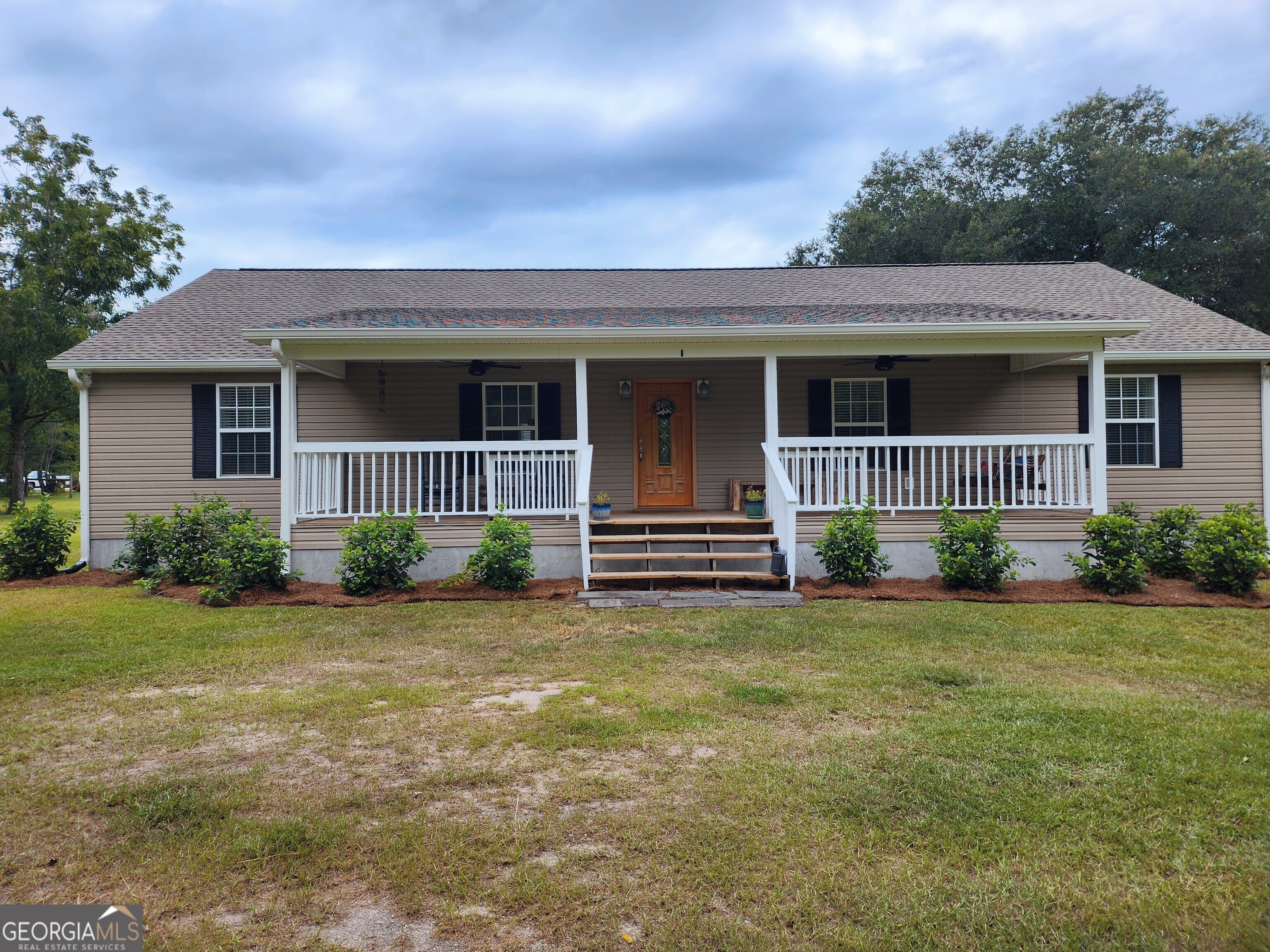 3517 Eldora Road Ellabell, GA 31308 - Photo 1 of 1 a front view of a house with garden