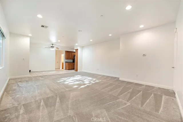 a view of an empty room with a bathroom