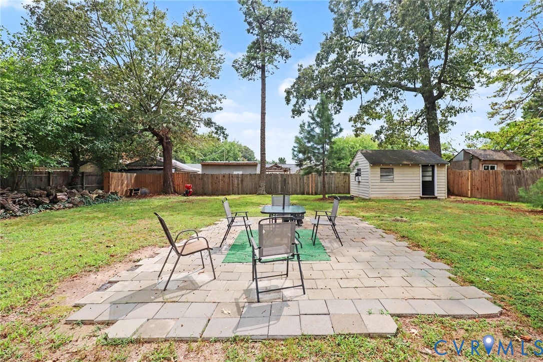 7213 Bennington Road Richmond, VA 23225 - Photo 19 of 24 Expansive backyard featuring a concrete paver pati