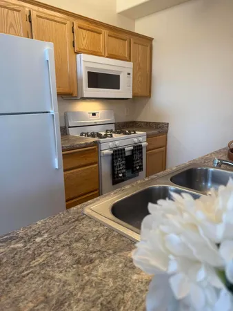 a kitchen with a stove and a microwave