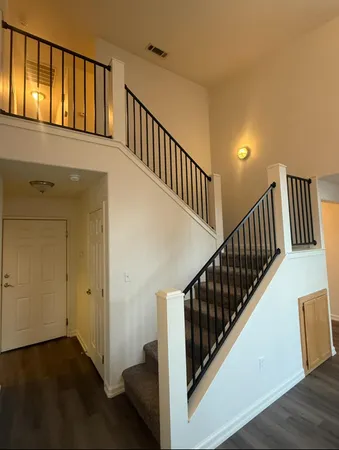 a view of staircase with railing and stairs