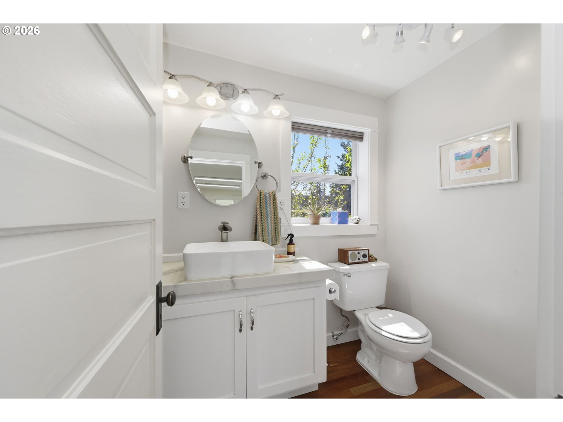 349 South 6th Street Cottage Grove, OR 97424 - Photo 14 of 28 a bathroom with a toilet sink and mirror