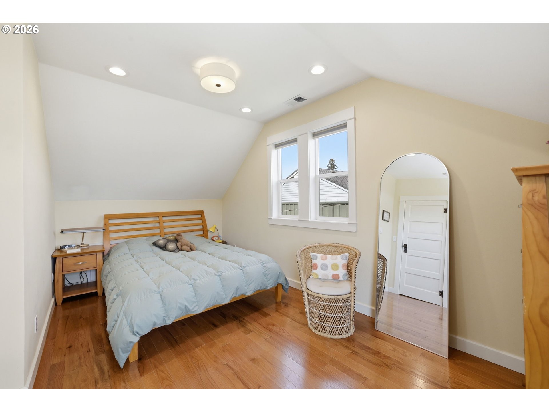 349 South 6th Street Cottage Grove, OR 97424 - Photo 15 of 28 a bedroom with a bed window and mirror