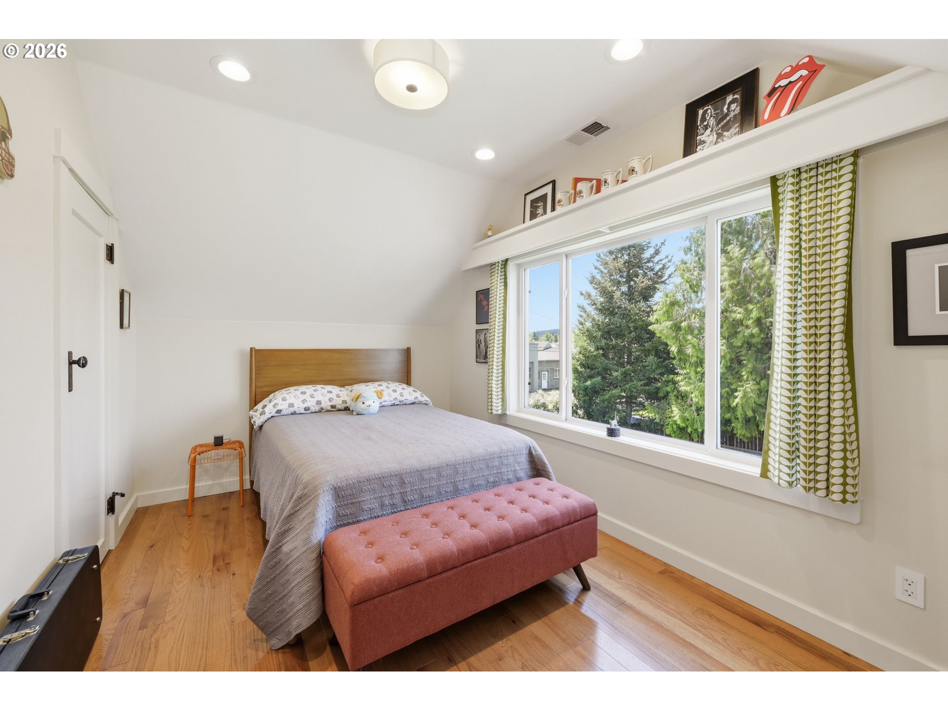 349 South 6th Street Cottage Grove, OR 97424 - Photo 20 of 28 a bedroom with furniture and a large window