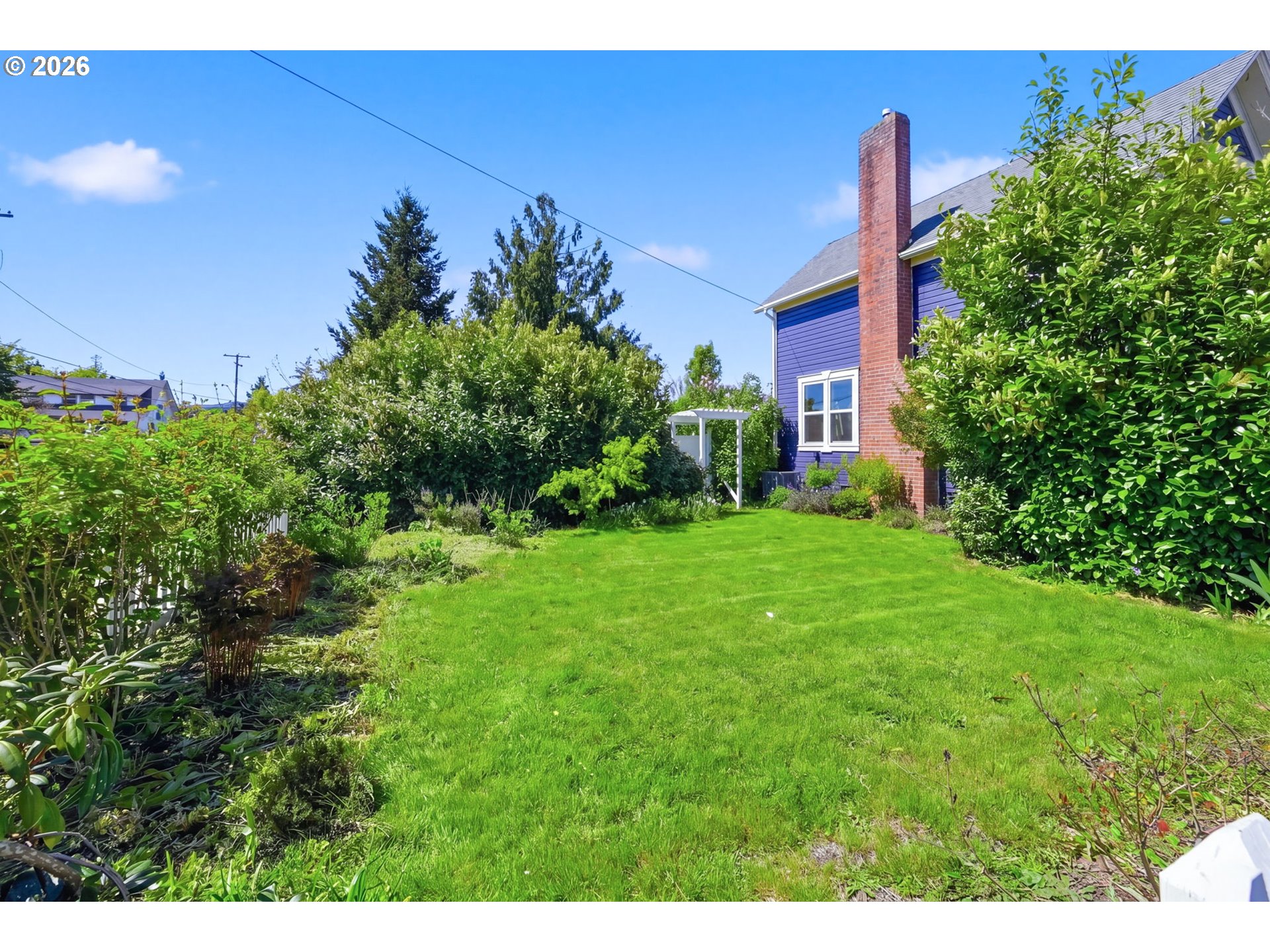 349 South 6th Street Cottage Grove, OR 97424 - Photo 26 of 28 a view of a house with a yard and potted plants