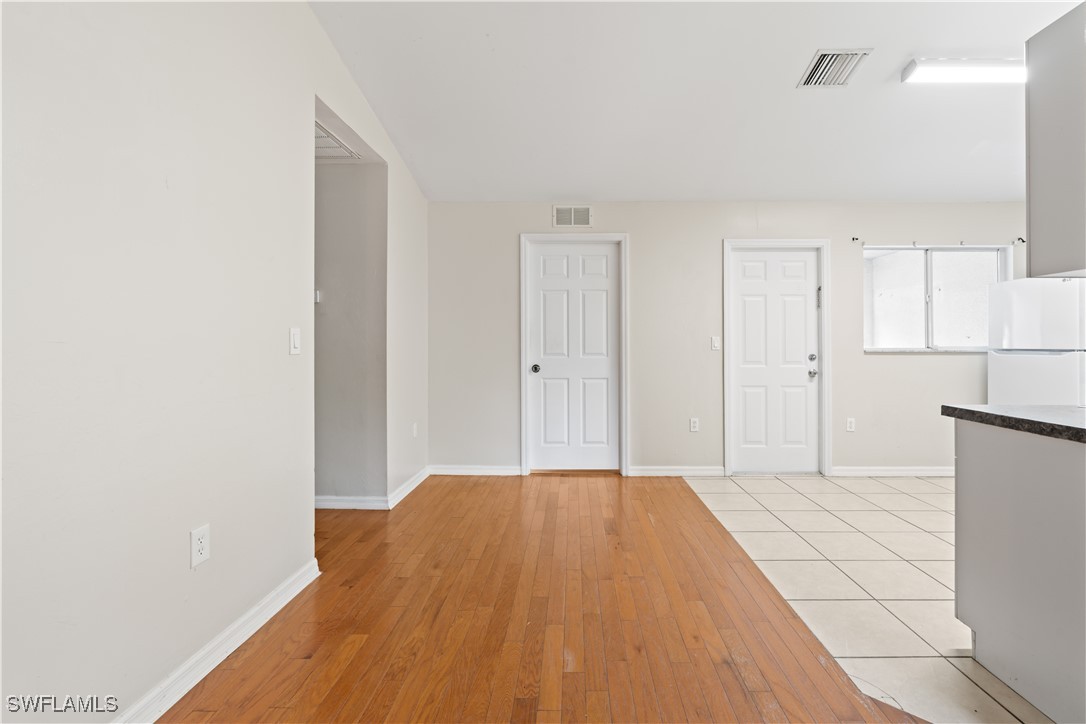 209 Meadow Road Lehigh Acres, FL 33973 - Photo 18 of 48 a view of a room with wooden floor