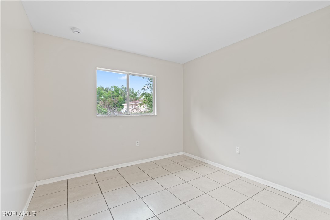 209 Meadow Road Lehigh Acres, FL 33973 - Photo 21 of 48 a view of an empty room