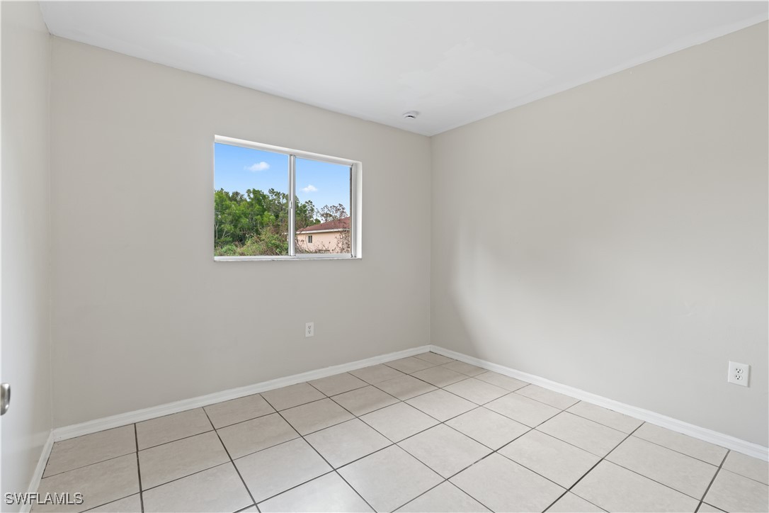 209 Meadow Road Lehigh Acres, FL 33973 - Photo 23 of 48 a view of room with window