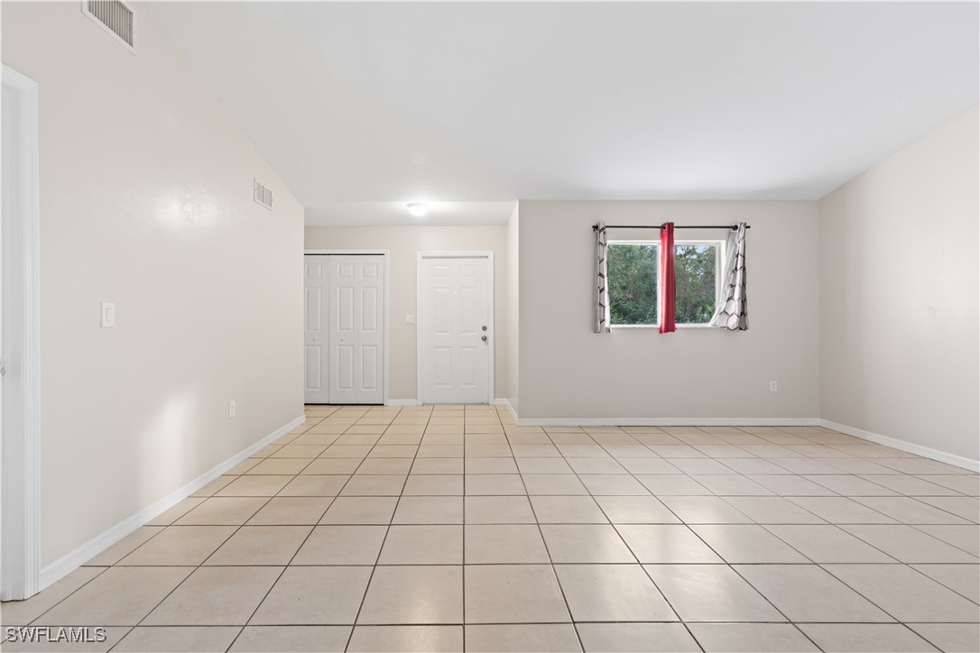 209 Meadow Road Lehigh Acres, FL 33973 - Photo 31 of 48 an empty room with windows and closet