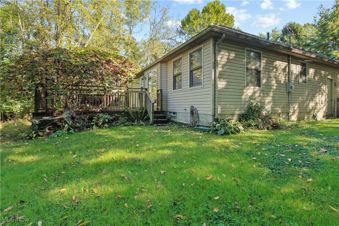2632 Berry Road Akron, OH 44320 - Photo 37 of 39 View of home's exterior with a wooden deck and a yard